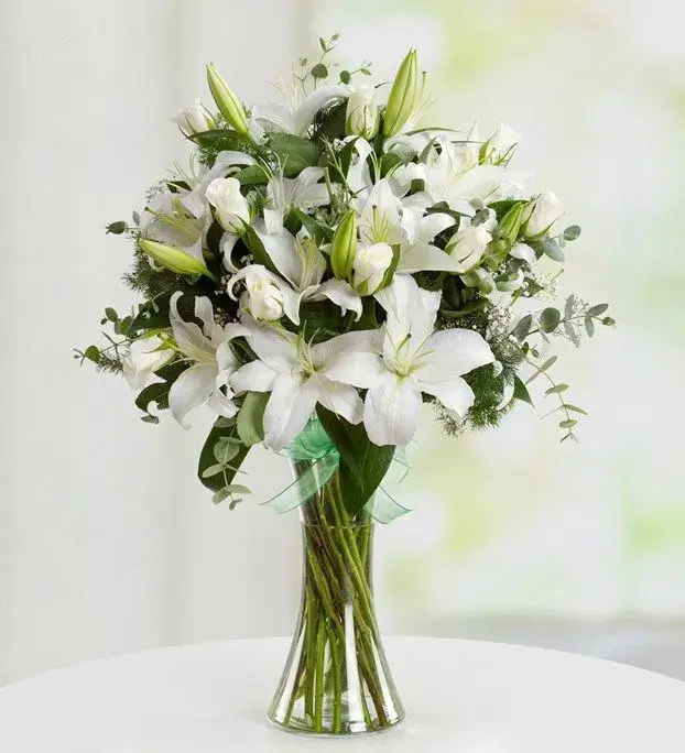 An elegant, tall arrangement of white lilies